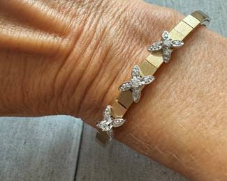 14kt gold Art deco style bracelet with diam in 3 flowers form. $1100