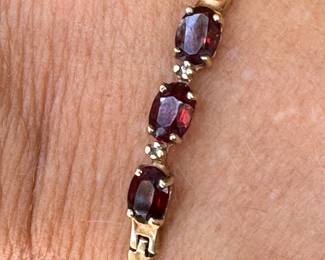 Bracelet 14kt yellow gold, 3 oval garnets, 7"long, 3.35 grams, $150.