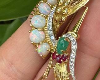 Extraordinary craftsmanship Crane 18kt gold brooch with Cabochon opal graduating size (5), 1 cabochon emerald and 5 natural emeralds with diamonds. weight 11.91 grams. Provenance from the Levin family - $1400