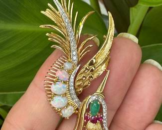Extraordinary craftsmanship Crane 18kt gold brooch with Cabochon opal graduating size (5), 1 cabochon emerald and 5 natural emeralds with diamonds. weight 11.91 grams. Provenance from the Levin family - $1400