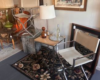 Chrome and Vinyl MCM chairs, MCM side table, black area rug, black wall mirror, Ralph Avery original painting