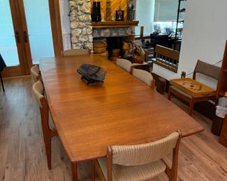 Teak table will fold easily into half that size.