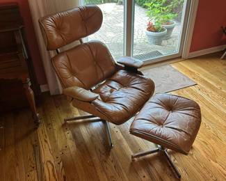 Eames style chair with ottoman.
