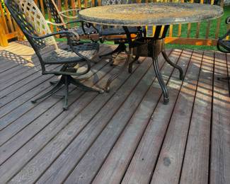 Extremely heavy mid century wrought iron table and rocker chairs $400. Needs a good coat of spray!
