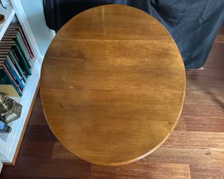 C80 - $60. Wooden Side Table with single drawer from Boston, MA. Measures 25" wide (without leaves up) 35.5" (with leaves up) 24.5" tall.