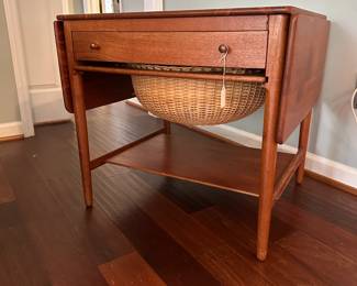 C88 - $850. 1950's Sewing Table AT-33 Hans Wegnar (by Anders Tuck) Minor imperfection noted in the picture. Measures 25.5" wide x 22.5" deep x 24" tall. Two Drop leaves are each 10.75" wide.