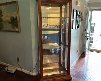 C18 - $150. Pulaski Curio / Display Cabinet. Lighted. Adjustable glass shelves. Doors open on both sides for access. Measures 34.25" wide x 15" deep x 80.5" tall.
