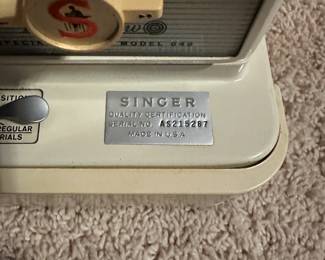C60 - $250. Singer Sewing Machine and Folding Sewing Table. Machine serial number AS215287 in great condition. Table is also in great condition, measures 32" Wide x 32" Deep x 28.5" Tall. Has cutout for machine to fit into.