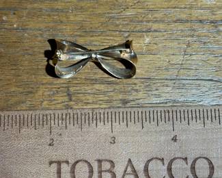 D11 - $220. 14kt gold bow brooch