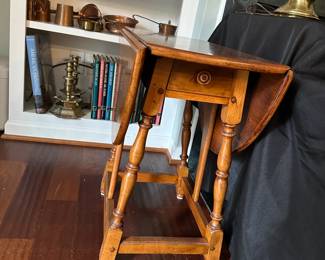 C80 - $60. Wooden Side Table with single drawer from Boston, MA. Measures 25" wide (without leaves up) 35.5" (with leaves up) 24.5" tall.