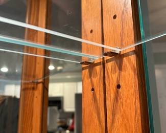 C18 - $150. Pulaski Curio / Display Cabinet. Lighted. Adjustable glass shelves. Doors open on both sides for access. Measures 34.25" wide x 15" deep x 80.5" tall.