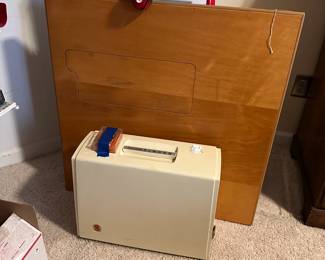 C60 - $250. Singer Sewing Machine and Folding Sewing Table. Machine serial number AS215287 in great condition. Table is also in great condition, measures 32" Wide x 32" Deep x 28.5" Tall. Has cutout for machine to fit into.