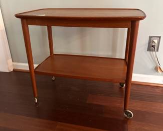 C90 - $250. MCM Wheeled Side Table. Measures 28.5" wide x 18" deep x 25" tall.