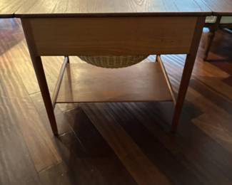 C88 - $850. 1950's Sewing Table AT-33 Hans Wegnar (by Anders Tuck) Minor imperfection noted in the picture. Measures 25.5" wide x 22.5" deep x 24" tall. Two Drop leaves are each 10.75" wide.