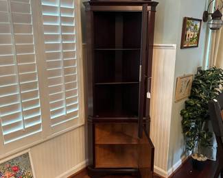 C15 - $250. Small Corner Curio With Key. Tag reads 1966 on the back. Measures 25" wide x 15" deep x 75" tall.