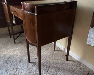 C42 - $250. Vanity & Mirror with sticker saying "Roskilde". (Probably made in Roskilde, Denmark.) Each side has a top that lifts up for jewelry storage. One door is open storage - one is drawers. Measures 50.25" wide x 20.5" deep x 33" tall. Mirror measures 37.5" tall and just screws onto the back. Decorative piece, between the legs, on the bottom right is missing. Less noticeable if its near a piece of furniture / bed.