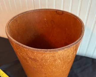 C10 - $350. Carl Aubock Leather Waste Basket with metal loop handle. Measures 11.5" Tall x 9.75" Wide.