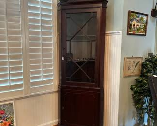 C15 - $250. Small Corner Curio With Key. Tag reads 1966 on the back. Measures 25" wide x 15" deep x 75" tall.