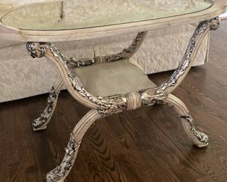 Unique ornate coffee table with glass top