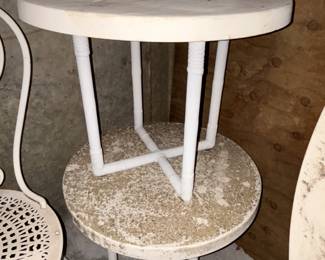Two small outdoor tables.