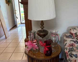 round side table, lamp, vases