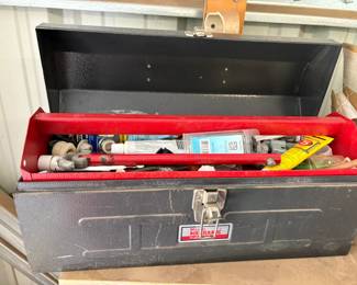 tool box filled with plumbing supplies