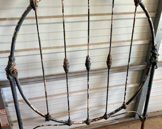 old iron bedstead--great for yard/garden art