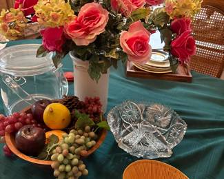 ice bucket, wood bowl with fruit, cut glass salad bowl, floral arrangement