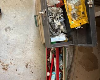 tool box filled with plumbing supplies