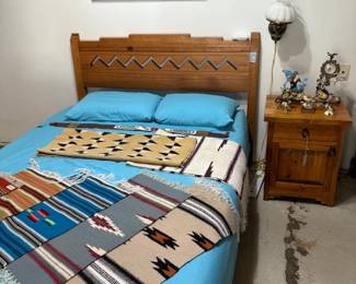 Southwest style queen size bed and weavings