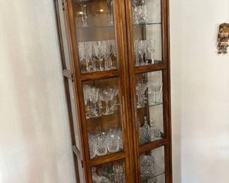 Display cabinet with glass shelves and light