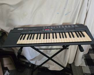 Yamaha Portable keyboard on stand
