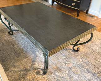Coffee table with gray top and metal legs