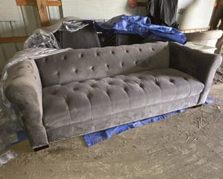 Gray velvet tufted sofa