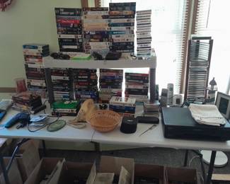 soooo many vhs tapes, thank goodness there is a player for sale also!