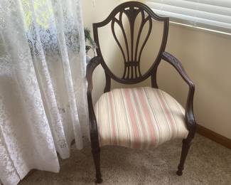 Antique arm chair shield back