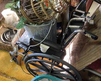 Wheel chair hiding under stuff