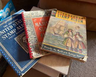 Stamp albums with some stamps