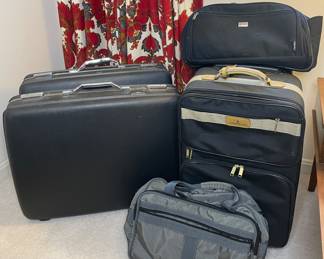 Vintage luggage includes American Tourister & London Fog