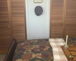Showing the comforter, and items on the Queen size sleigh bed.