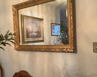 Gold mirror in dining room. Measures: 41 1/2” wide x 29 1/4” tall.