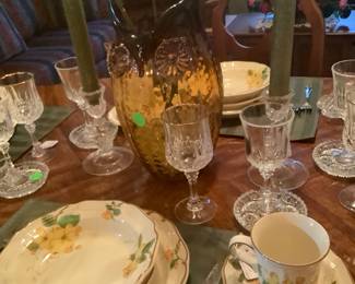 Close-up of china, crystal and center piece.