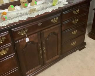 The front of the dresser. The price is: 300.00 Has a tri-fold mirror.