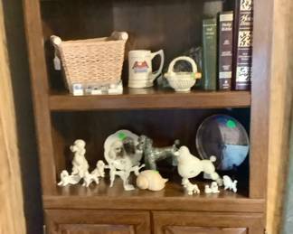 Bookcase with doors. Measures 29 3/4” width, 71 1/4” tall, 12 1/2” depth. Price: 85.00