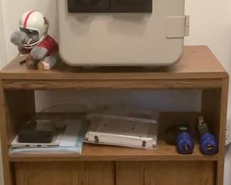TV stand. Measures: 28” tall, 20” depth, 26 1/2” wide. Price: 40.00