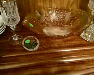 Beautiful colored bowl in China cabinet.
