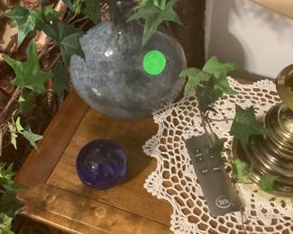 Decorative items on walnut end table.