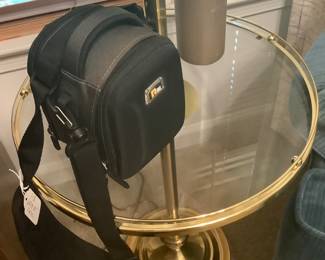 A brass and glass floor lamp.