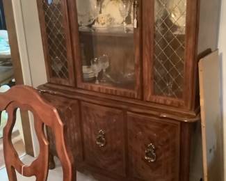 The Basset China cabinet matching table. It measures: 48” wide x 79 1/2” tall, 17” depth. It also has glass shelves and a light. Shelves on bottom. Price is: 285.00