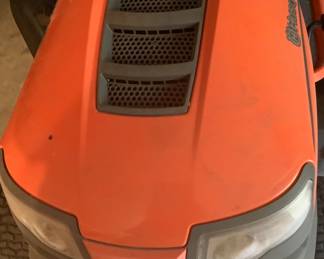 Riding lawn mower. Has grass catcher on it. Price: 2,100.00. Has brand new battery.